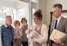 During family dinner, I cried, “My contractions have started!” Dad responded, “Call emergency services and stop interrupting us.” Not one person got up to assist me. One week later, my parents arrived smiling, saying, “We’re here to meet our grandchild.” I answered, “You left us alone that night.” Then the man behind me opened the door—and Dad turned pale.
